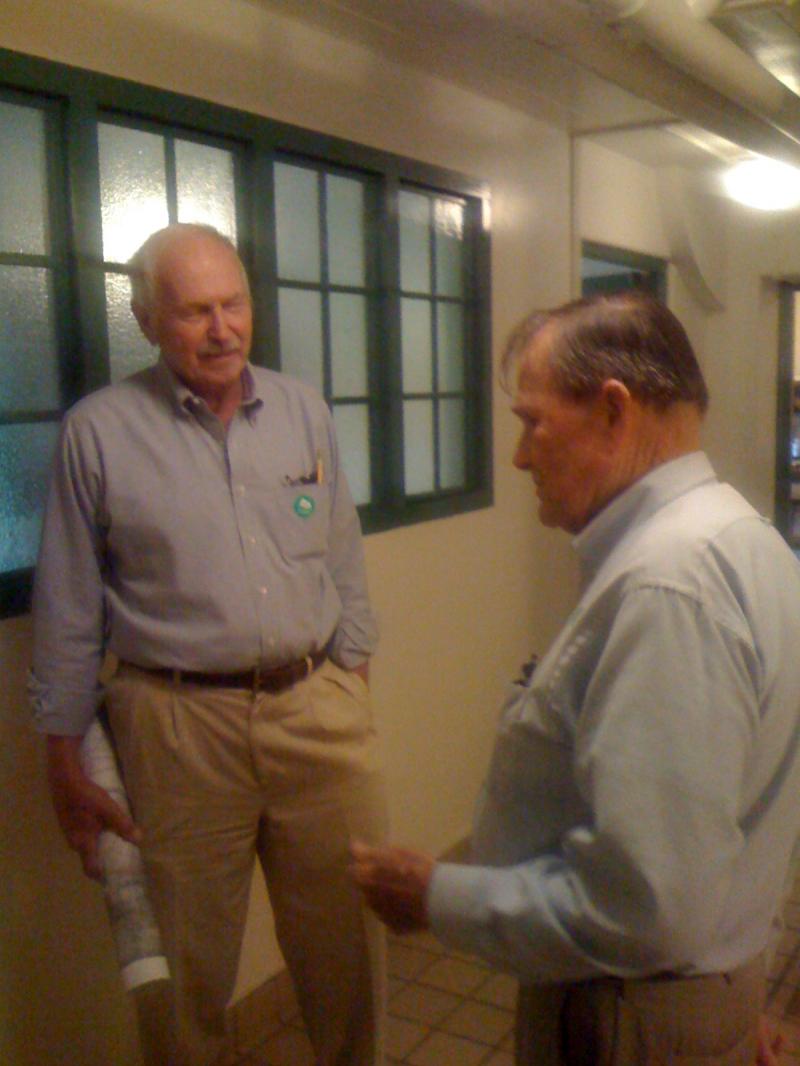 Shipwright Allen Rawl talks with Francis "Nick" DuPont